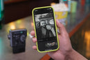 Fujifilm Instax Mini Evo Cinema printing a photo with a QR code for smartphone video playback