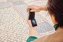 Person using a Panasonic L 10 on a cobblestone street - From best camera store toronto