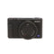 Black Sony camera with Zeiss lens on a white background
