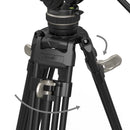 Close-up of a camera tripod with a focus on the adjustable leg section.