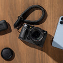 SmallRig Black Leather Half Case for FUJIFILM X-M5 on camera body front view with wrist strap.