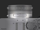 Close-up top detail of silver Panasonic LUMIX L10 customizable Fn switch and mode dial at Best Camera Store