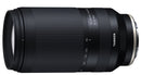 Black camera lens with 'Tamron' branding on a white background at Best Camera Store