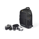 Rear-access camera compartment of the Lowepro Adventura BP 150 III backpack packed with a mirrorless camera, extra lens, and a compact foldable drone.