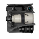 Top-down view of the removable molded EVA QuickShelf divider system holding a Sony mirrorless camera body, 70-200mm telephoto lens, flash, and wide-angle lens.