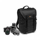 Lowepro ProTactic BP 300 AW II photography daypack standing alongside a mirrorless camera body, extra zoom lenses, and a compact travel drone.