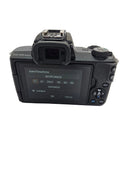 Detailed look at the operational base battery door compartment layout on the used Canon M50 Mark II camera body.
