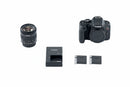 A professional overhead photograph of the entire Canon T7i kit, including the body, lens, two batteries, charger, and manual.