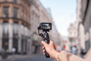 Cyclist using a handlebar mount with the DJI Osmo Action 6 to record a road ride.