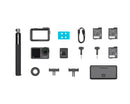 Symmetrical flat lay presentation of all contents included in the DJI Osmo Action 4 Adventure Combo bundle on a clean white surface.