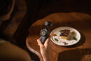 Complete DJI Osmo Pocket 3 Creator Combo neatly displayed photographic food on a wooden table.