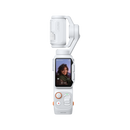 A white handheld gimbal camera with a front-facing screen showing a selfie, featuring orange accent buttons and a textured wind guard on the top mount, set against a plain white background.
