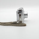 Side angle view of the camera showing the wrist strap placement and clean connections.