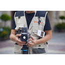 The Godox C100 mini camera being used as a light meter by a photographer operating a vintage film camera. Available at Best Camera Store.