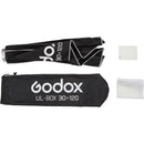 Godox ultralight studio flash box with accessories on a white background