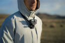 The mount laid out showing the included chest strap attachment and locking screw