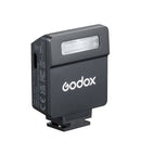 Godox camera flash unit on a white background