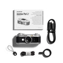 Fujifilm Instax Pal 2 digital camera shown with its retail box, USB cable, strap, and carrying case on a clean white background.