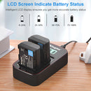 Two KingMa LP-E6 batteries charging on a desk with the intelligent LCD screen indicating exact power capacity levels from 0 to 100 percent.