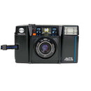 Side angle view of Minolta AF-S 35mm autofocus camera showing detachable lens cap at Best Camera Store