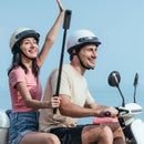 Happy couple riding a scooter using the Insta360 invisible selfie stick for action shots, available at Best Camera Store.