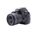 Side profile of the Nikon D3400 body showing the clean grip and port covers.