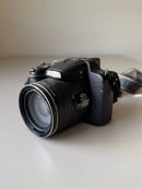 Nikon Coolpix P530 camera bundle with EN-EL5 battery, wall charger, and accessories.