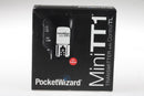 Open box PocketWizard MiniTT1 for Canon with original packaging and manuals