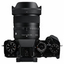 Sigma 15mm f/1.4 lens mounted on a compact Fujifilm APS-C camera, ideal for vlogging and travel.