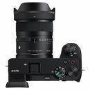 Sigma 15mm f/1.4 lens mounted on a compact Sony APS-C camera, ideal for vlogging and travel.