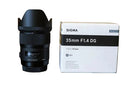 Sigma 35mm f1.4 Art lens with original bag, caps, and instruction manuals
