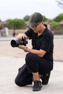 Photographer shooting with Sigma 85mm f1.2 DG Art lens - Best Camera Store