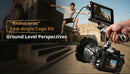 Handheld shooting setup utilizing the SmallRig Rhinoceros top handle for steady, low-angle filmmaking with a Sony camera.
