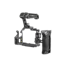 Handheld shooting setup utilizing the SmallRig Rhinoceros top handle for steady, low-angle filmmaking with a Sony camera.