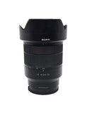 Used Sony 24-70mm Zeiss lens kit including ALC-SH130 hood, front cap, and rear cap.