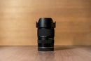 Studio side profile view of the Tamron 16-50mm f/2.8 Di III-A VXD lens from Best Camera Store.