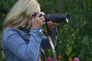 Photographer capturing outdoor shots using the Tamron 70-300mm f/4.5-6.3 lens on a Sony mirrorless camera from Best Camera Store.