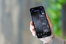 Close-up of the Tamron Lens Utility Mobile app interface on an iPhone showing wireless focus and aperture control settings.