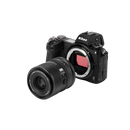 Viltrox 35mm F1.8 EVO full frame lens sitting next to an unmounted Nikon Z mount mirrorless camera at best camera store