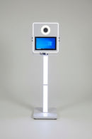 Front view of the white Vista 15.6 inch square DSLR photo booth showing the touchscreen monitor and RGB LED light frame border.