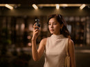 Women vloging and holding the DJI osmo pocket 3 in hand